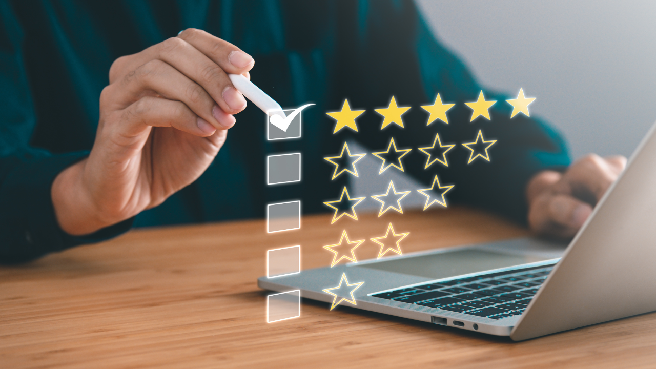 Hand checking a box on a laptop with floating five-star rating icons, leaving an online review for a salon service.