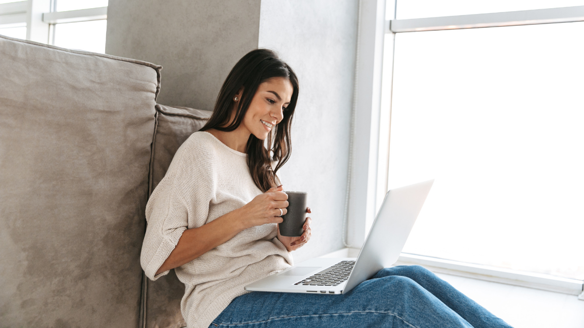 Beauty professional creating a client-focused bio on her laptop
